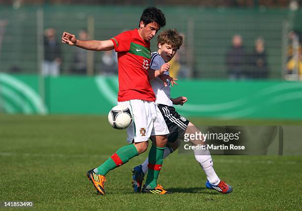 Max Meyer of Germany and Cristian of Portugal battle for the ball during the U17 Men's Elite Round match between Germany and Portugal on March 25,...