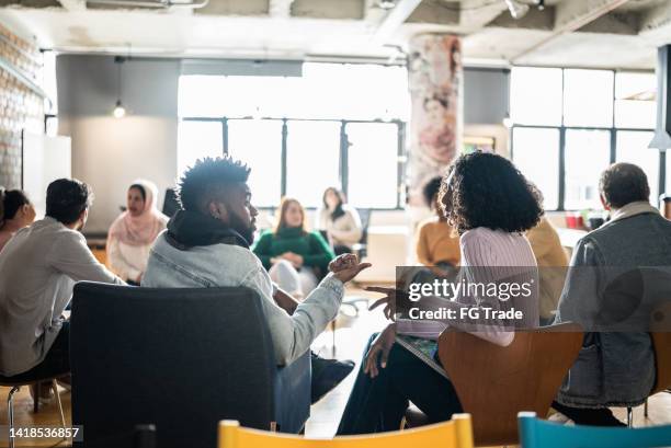 adult students talking in the classroom - grupp av människor bildbanksfoton och bilder