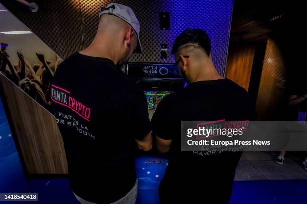 Cryptocurrency event attendees enjoy the video games installed at the event, at the WiZink Center, on August 26 in Madrid, Spain. The most recognized...