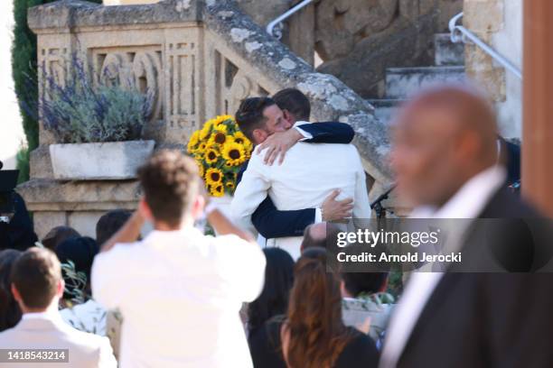 Simon Porte Jacquemus hugs his husband Marco Maestri during the ceremony of the wedding of Simon Porte Jacquemus And Marco Maestri on August 27, 2022...