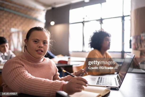 portrait of a young woman with special needs in the classroom - brazil girls supporters stock pictures, royalty-free photos & images