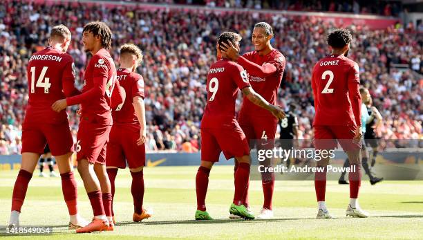 Roberto Firmino of Liverpool celebrates after scoring the fourth goal with Virgil van Dijk of Liverpool during the Premier League match between...