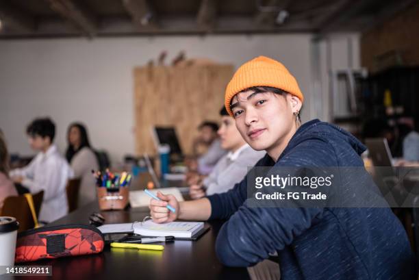 portrait of a young man in the classroom - secondary school child stock pictures, royalty-free photos & images