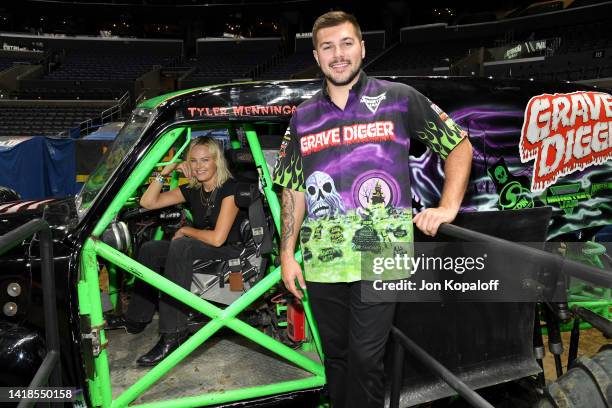 Malin Åkerman and Tyler Menninga attend Monster Jam at Crypto.com Arena on August 27, 2022 in Los Angeles, California.