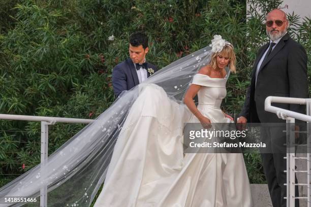 Federica Pellegrini and Matteo Giunta arrive at the Marriott Hotel on the Isle of Roses in Venice after their wedding on August 27, 2022 in Venice,...