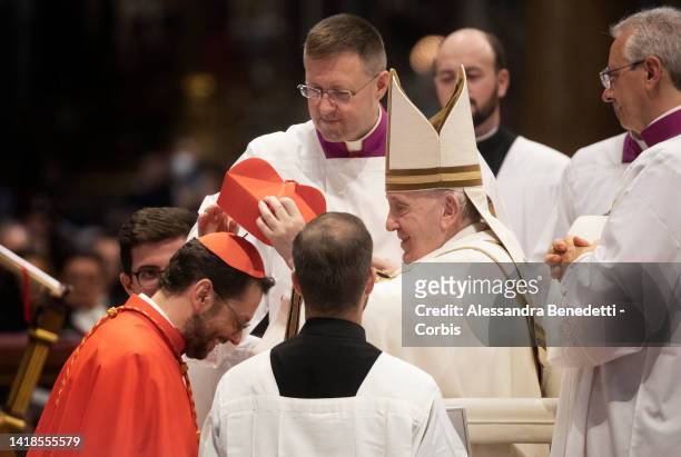 Newly appointed Cardinal Giorgio Marengo receives the red hat, biretta from Pope Francis during an extraordinary consistory for the creation of 21...