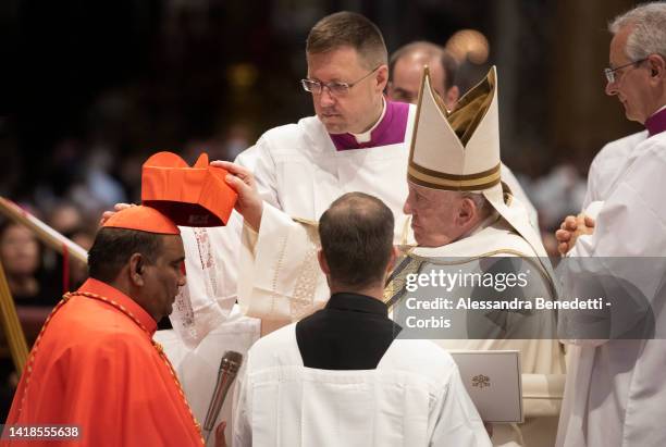 Newly appointed Cardinal Anthony Poola receives the red hat ,Biretta, from Pope Francis leads an extraordinary consistory for the creation of 21...