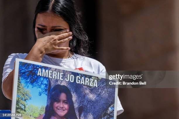 Kimberly Garcia holds a poster of her daughter Amerie Jo Garza, who was murdered during the mass shooting at Robb Elementary, during a March For Our...