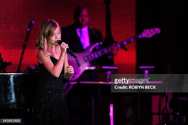 Singer Jackie Evancho performs on stage at Muhammad Ali's Celebrity Fight Night XVIII on March 24, 2012 in Phoenix, Arizona. The event supports the...