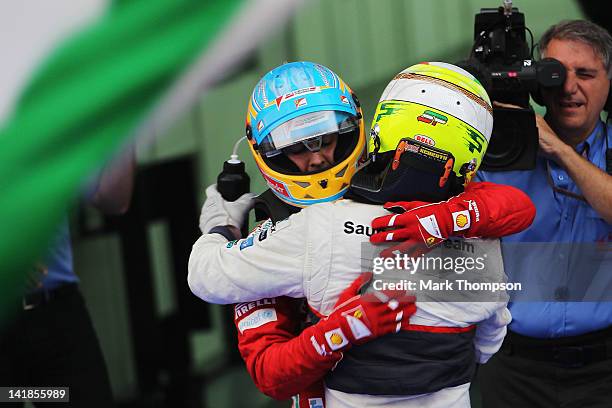 Race winner Fernando Alonso of Spain and Ferrari and second placed Sergio Perez of Mexico and Sauber F1 celebrate in parc ferme following the...