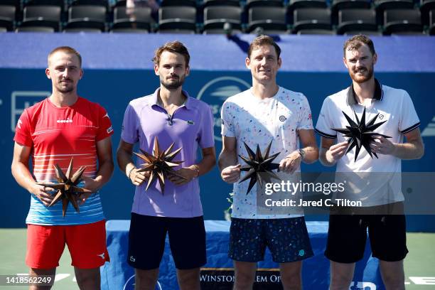 Champions Jamie Murray of Great Britain and Matthew Ebden of Australia pose with finalists Hugo Nys of Monaco and Jan Zielinski of Poland following...