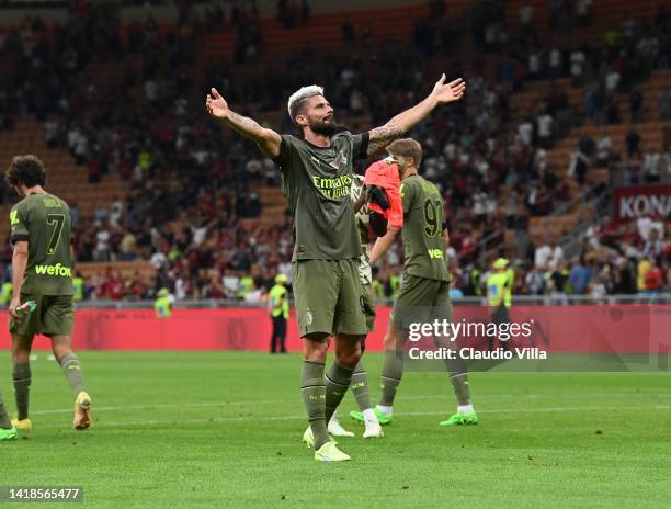 Olivier Giroud of AC Milan celebrates the win at the end of the Serie A match between AC Milan and Bologna FC at Stadio Giuseppe Meazza on August 27,...