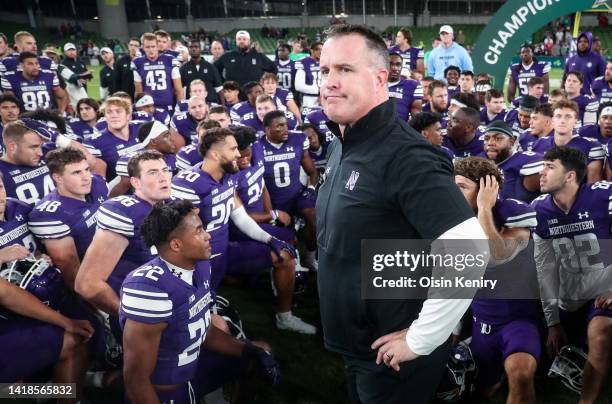 Northwestern Wildcats head coach, Pat Fitzgerald is speaks to his team after the the Aer Lingus College Football Classic 2022 match between...