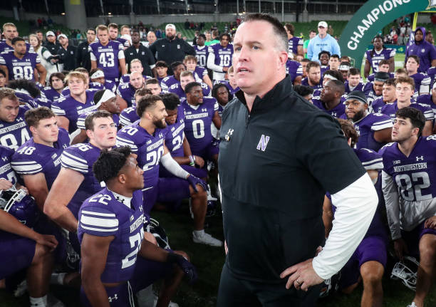 Northwestern Wildcats head coach, Pat Fitzgerald is speaks to his team after the the Aer Lingus College Football Classic 2022 match between...