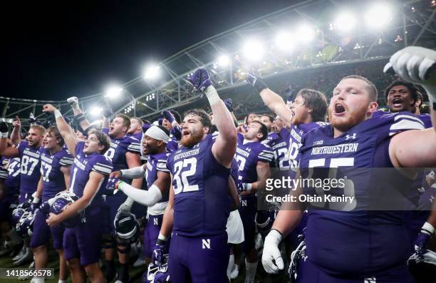 Northwestern Wildcats celebrate their victory towards the fans after the Aer Lingus College Football Classic 2022 match between Northwestern Wildcats...