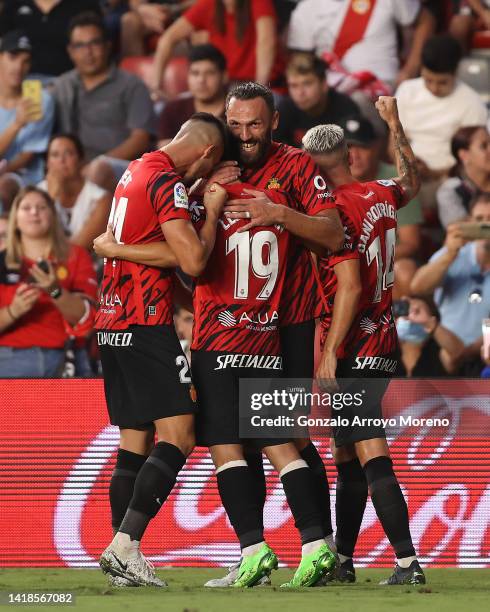 Kang In Lee celebrates scoring their second goal with teammates Vedat Muriqi , Martin Valjent and Dani Rodriguez during the LaLiga Santander match...