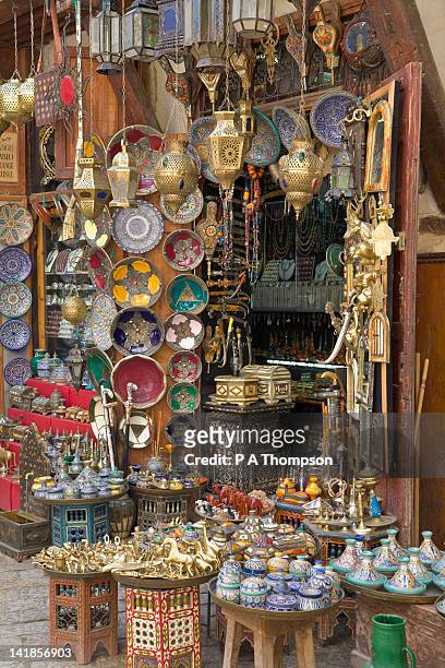 shop selling pottery and brass, fez, morocco - ceramics fez stock-fotos und bilder