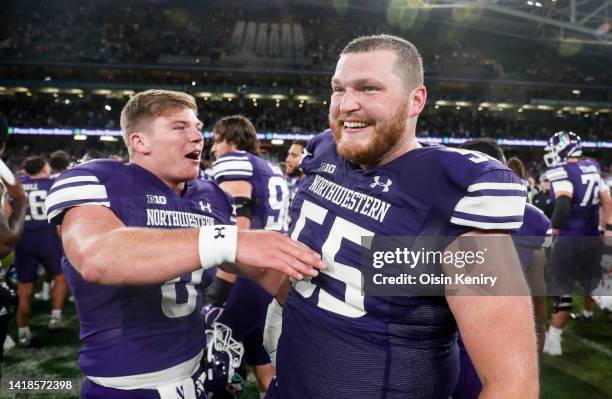 Cole Freeman and Conrad Rowley of Northwestern Wildcats celebrate after the Aer Lingus College Football Classic 2022 match between Northwestern...