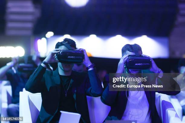 Attendees at the cryptocurrency event with 3D glasses, at the WiZink Center, on August 26 in Madrid, Spain. The most recognized brands in the crypto...