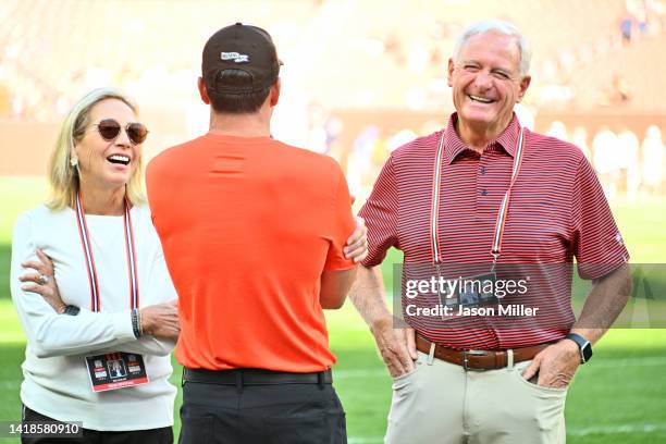 Head coach Kevin Stefanski of the Chicago Bears talks with team owners Dee and Jimmy Haslam of the Cleveland Browns prior to a preseason game between...