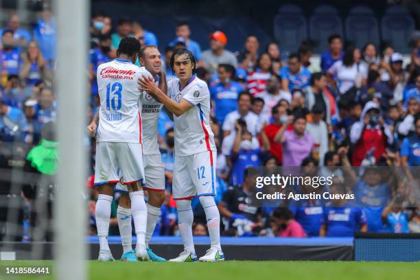 Carlos Rotondi of Cruz Azul celebrates the first goal of his team with Jose Joaquin Martinez and Michael Estrada of Cruz Azul during the 11th round...