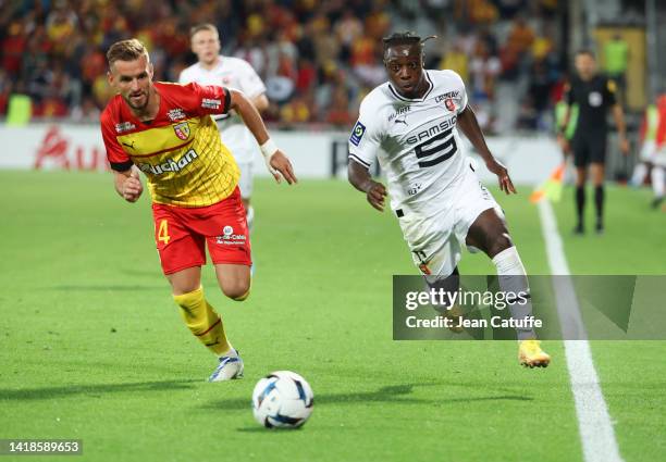 Jonathan Gradit of Lens, Jeremy Doku of Rennes during the Ligue 1 Uber Eats match between RC Lens and Stade Rennais at Stade Bollaert-Delelis on...