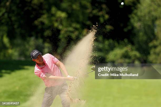 Padraig Harrington of Ireland hits out of a greenside bunker on the first hole during the second round of The Ally Challenge at Warwick Hills Golf...