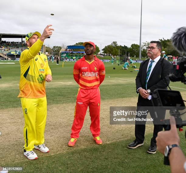 Aaron Finch of Australia tosses the coin ahead of game one of the One Day International Series between Australia and Zimbabwe at Riverway Stadium on...