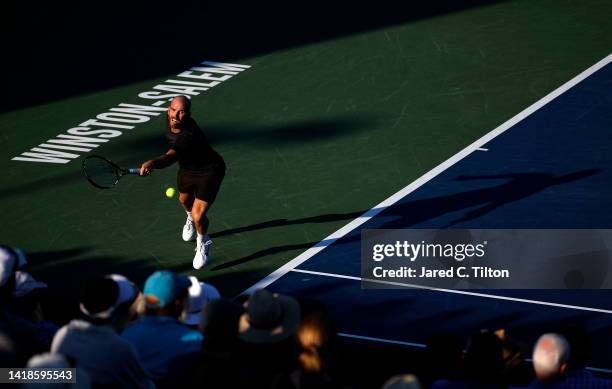 Adrian Mannarino of France returns a shot from Laslo Djere of Serbia during the men's singles championship final on day eight of the Winston-Salem...