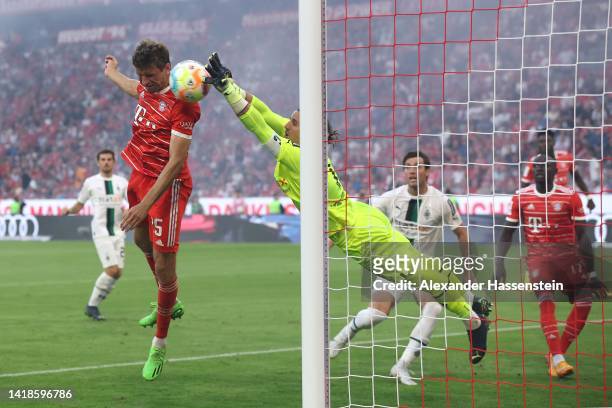 Thomas Müller of Bayern Munich shoots while under pressure from Yann Sommer of Borussia Monchengladbach during the Bundesliga match between FC Bayern...