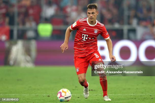 Joshua Kimmich of Bayern München runs with the ball during the Bundesliga match between FC Bayern München and Borussia Mönchengladbach at Allianz...