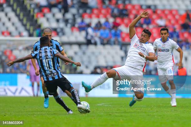 Ivan Morales of Cruz Azul fights for the ball with Clifford Aboagye of Queretaro during the 11th round match between Cruz Azul and Queretaro as part...