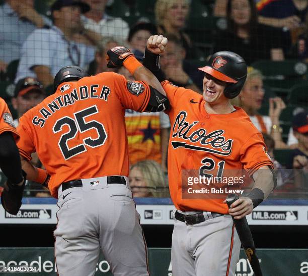 Anthony Santander of the Baltimore Orioles is congratulated by Austin Hays after hitting a two run home run ion the third inningc against the Houston...