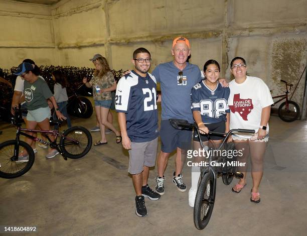 Lance Armstrong poses with families and students from Robb Elementary and Flores Elementary schools during Operation Get Out's bikes for kids...