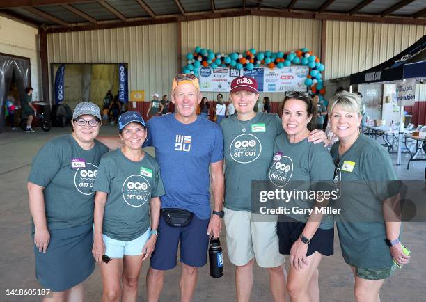 Lance Armstrong with volunteers during Operation Get Out's bikes for kids giveaway for students and families of Robb Elementary and Flores Elementary...