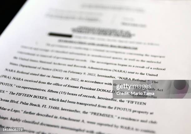 In this photo illustration, a page is viewed from the government’s released version of the F.B.I. Search warrant affidavit for former President...