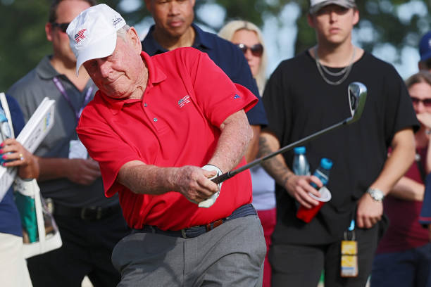 Jack Nicklaus hits an approach shot on the 18th hole during a celebrity shootout after the second round of The Ally Challenge at Warwick Hills Golf...
