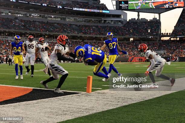 Bryce Perkins of the Los Angeles Rams scores a touchdown while defended by Allan George of the Cincinnati Bengals during the fourth quarter at Paycor...