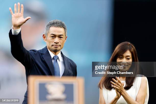 Former Seattle Mariner Ichiro Suzuki and his wife Yumiko Fukushima look on during his induction into the Mariners Hall of Fame prior to the game...