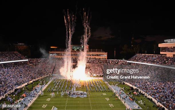 Fireworks explode as the North Carolina Tar Heels take the field for their game against the Florida A&M Rattlers at Kenan Memorial Stadium on August...