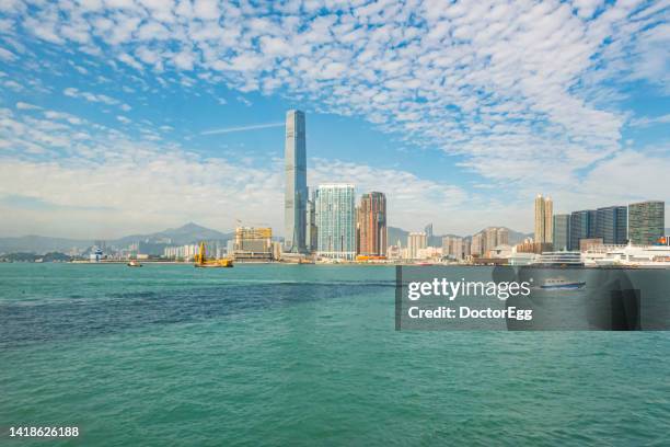 scenic landscape of icc building with victoria harbor, hong kong - kowloon 個照片及圖片檔