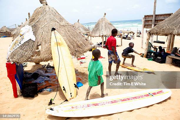 children play on yoff beach, dakar, senegal, africa - city to surf stock pictures, royalty-free photos & images