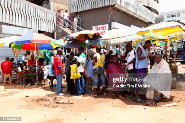 row of barbers, yaounde cameroon - cameroon city stock pictures, royalty-free photos & images