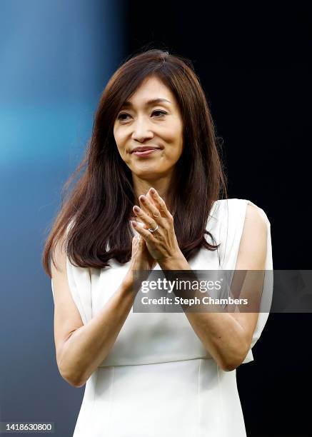 Yumiko Fukushima, wife of former Seattle Mariner Ichiro Suzuki, claps during the Mariners Hall of Fame pregame ceremony prior to the game between the...