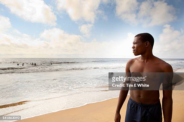 man on beach, kribi, cameroon, africa - cameroon forest stock pictures, royalty-free photos & images