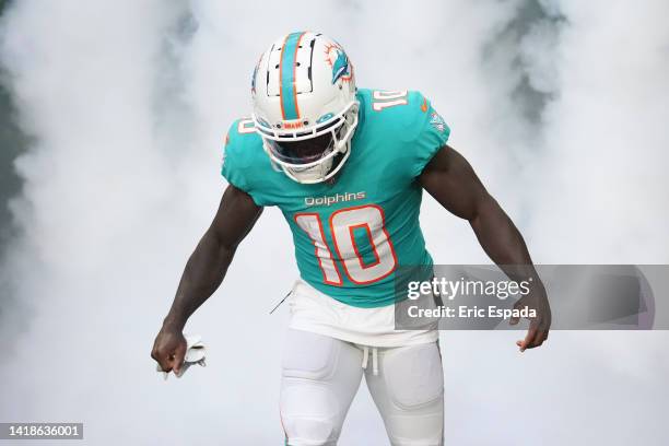 Tyreek Hill of the Miami Dolphins takes the field prior to the preseason game against the Philadelphia Eagles at Hard Rock Stadium on August 27, 2022...