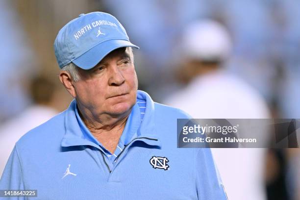 Head coach Mack Brown of the North Carolina Tar Heels watches his team warm up before their game against the Florida A&M Rattlers at Kenan Memorial...