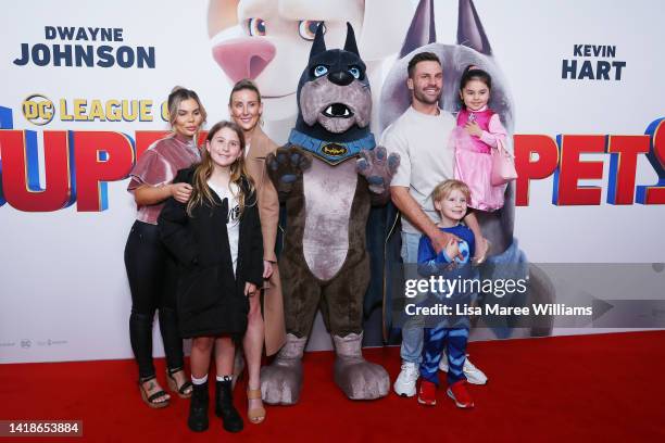 Kara Ryan and Beau Ryan pose alongside their children and a film character at the Sydney premiere of "League Of Superpets" on August 28, 2022 in...