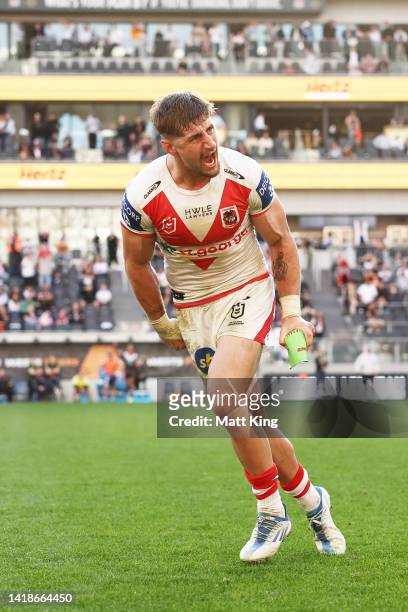 Zac Lomax of the Dragons celebrates kicking the winning penalty goal in the final minute during the round 24 NRL match between the Wests Tigers and...