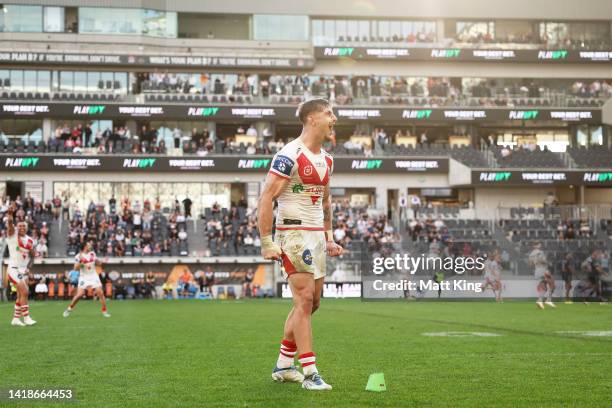 Zac Lomax of the Dragons celebrates kicking the winning penalty goal in the final minute during the round 24 NRL match between the Wests Tigers and...